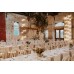 Trestle tables with white linen, accompanied by our white bentwood chairs